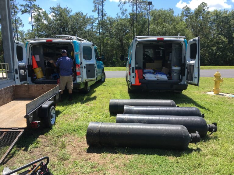 Water treatment tanks outside vans